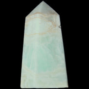 Pistachio Calcite obelisk 72*35*24mm 110g in sunlight - Rocks and Things Store