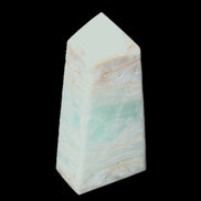 Pistachio Calcite obelisk 72*35*24mm 110g in sunlight - Rocks and Things Store