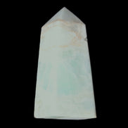 Pistachio Calcite obelisk 72*35*24mm 110g in sunlight - Rocks and Things Store