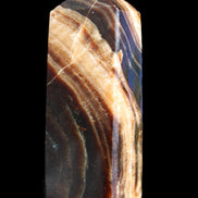 Chocolate Calcite obelisk 95*31*23mm 172g in sunlight - Rocks and Things Store