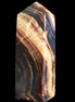 Chocolate Calcite obelisk 95*31*23mm 172g in sunlight - Rocks and Things Store