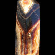 Chocolate Calcite obelisk 95*31*23mm 172g in sunlight - Rocks and Things Store
