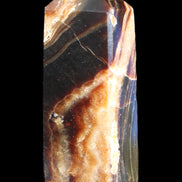 Chocolate Calcite obelisk 95*31*23mm 172g in sunlight - Rocks and Things Store