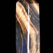 Chocolate Calcite obelisk 95*31*23mm 172g in sunlight - Rocks and Things Store