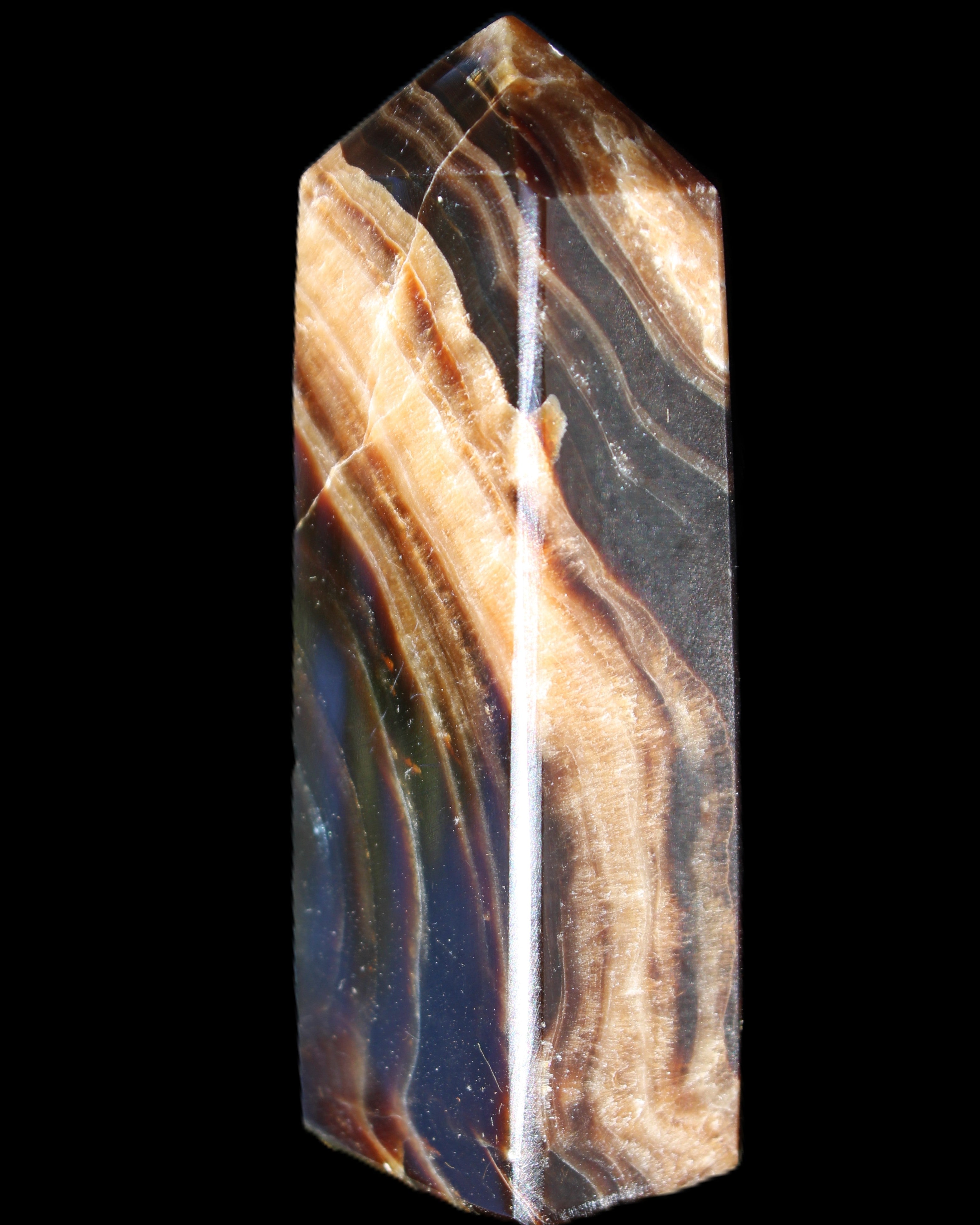Chocolate Calcite obelisk 95*31*23mm 172g in sunlight - Rocks and Things Store