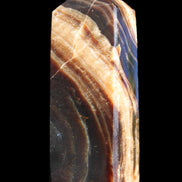 Chocolate Calcite obelisk 95*31*23mm 172g in sunlight - Rocks and Things Store
