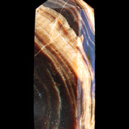 Chocolate Calcite obelisk 95*31*23mm 172g in sunlight - Rocks and Things Store