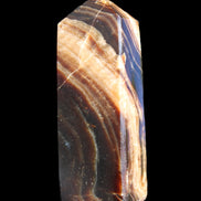 Chocolate Calcite obelisk 95*31*23mm 172g in sunlight - Rocks and Things Store