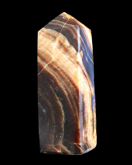 Chocolate Calcite obelisk 95*31*23mm 172g in sunlight - Rocks and Things Store