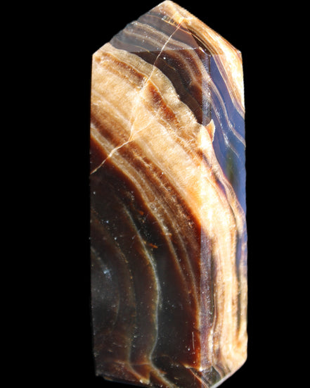Chocolate Calcite obelisk 95*31*23mm 172g in sunlight - Rocks and Things Store