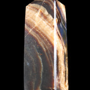 Chocolate Calcite obelisk 95*31*23mm 172g in sunlight - Rocks and Things Store