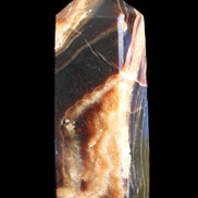 Chocolate Calcite obelisk 95*31*23mm 172g in sunlight - Rocks and Things Store