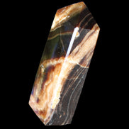 Chocolate Calcite obelisk 95*31*23mm 172g in sunlight - Rocks and Things Store