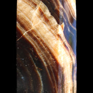 Chocolate Calcite obelisk 95*31*23mm 172g in sunlight - Rocks and Things Store