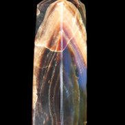 Chocolate Calcite obelisk 95*31*23mm 172g in sunlight - Rocks and Things Store