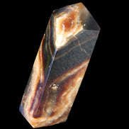 Chocolate Calcite obelisk 95*31*23mm 172g in sunlight - Rocks and Things Store