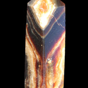 Chocolate Calcite obelisk 95*31*23mm 172g in sunlight - Rocks and Things Store