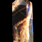 Chocolate Calcite obelisk 95*31*23mm 172g in sunlight - Rocks and Things Store
