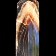 Chocolate Calcite obelisk 95*31*23mm 172g in sunlight - Rocks and Things Store