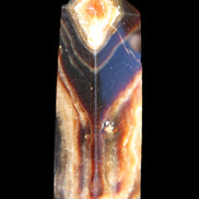 Chocolate Calcite obelisk 95*31*23mm 172g in sunlight - Rocks and Things Store
