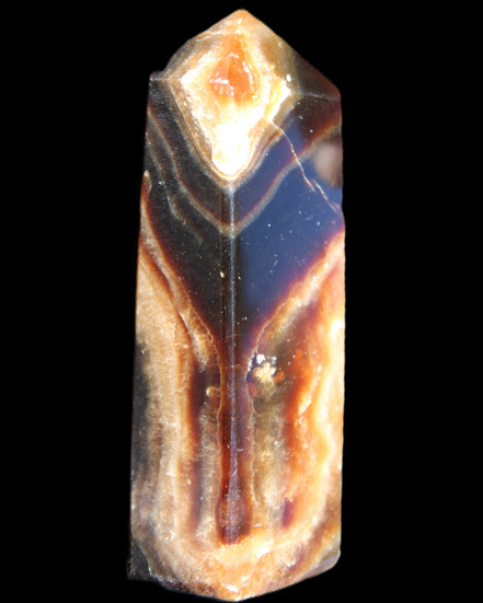 Chocolate Calcite obelisk 95*31*23mm 172g in sunlight - Rocks and Things Store