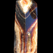 Chocolate Calcite obelisk 95*31*23mm 172g in sunlight - Rocks and Things Store
