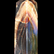 Chocolate Calcite obelisk 95*31*23mm 172g in sunlight - Rocks and Things Store