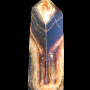 Chocolate Calcite obelisk 95*31*23mm 172g in sunlight - Rocks and Things Store