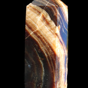 Chocolate Calcite obelisk 95*31*23mm 172g in sunlight - Rocks and Things Store