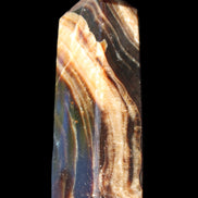 Chocolate Calcite obelisk 95*31*23mm 172g in sunlight - Rocks and Things Store