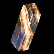 Chocolate Calcite obelisk 95*31*23mm 172g in sunlight - Rocks and Things Store