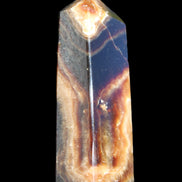 Chocolate Calcite obelisk 95*31*23mm 172g in sunlight - Rocks and Things Store