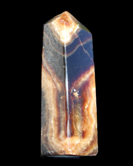Chocolate Calcite obelisk 95*31*23mm 172g in sunlight - Rocks and Things Store