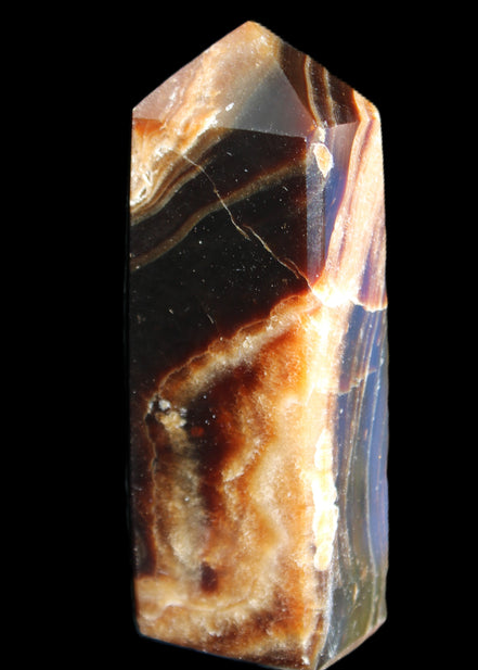 Chocolate Calcite obelisk 95*31*23mm 172g in sunlight - Rocks and Things Store