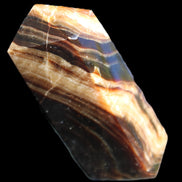 Chocolate Calcite obelisk 95*31*23mm 172g in sunlight - Rocks and Things Store