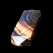 Chocolate Calcite obelisk 95*31*23mm 172g in sunlight - Rocks and Things Store