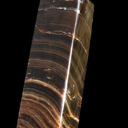 Chocolate Calcite obelisk 114*33*26mm 249g in sunlight - Rocks and Things Store