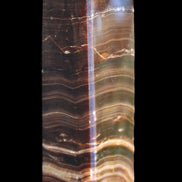 Chocolate Calcite obelisk 114*33*26mm 249g in sunlight - Rocks and Things Store