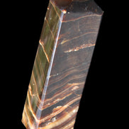 Chocolate Calcite obelisk 114*33*26mm 249g in sunlight - Rocks and Things Store