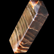 Chocolate Calcite obelisk 114*33*26mm 249g in sunlight - Rocks and Things Store
