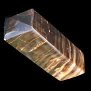 Chocolate Calcite obelisk 114*33*26mm 249g in sunlight - Rocks and Things Store