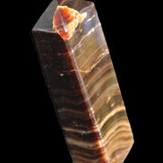Chocolate Calcite obelisk 114*33*26mm 249g in sunlight - Rocks and Things Store