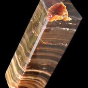 Chocolate Calcite obelisk 114*33*26mm 249g in sunlight - Rocks and Things Store