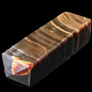 Chocolate Calcite obelisk 114*33*26mm 249g in sunlight - Rocks and Things Store
