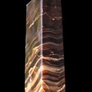 Chocolate Calcite obelisk 114*33*26mm 249g in sunlight - Rocks and Things Store