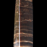 Chocolate Calcite obelisk 110*30*24mm 214g in sunlight - Rocks and Things Store