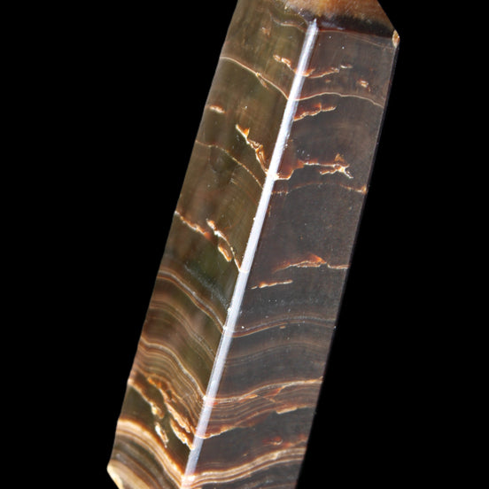Chocolate Calcite obelisk 110*30*24mm 214g in sunlight - Rocks and Things Store