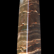 Chocolate Calcite obelisk 110*30*24mm 214g in sunlight - Rocks and Things Store