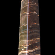 Chocolate Calcite obelisk 110*30*24mm 214g in sunlight - Rocks and Things Store