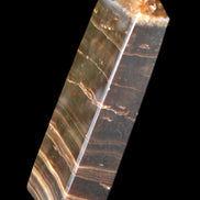 Chocolate Calcite obelisk 110*30*24mm 214g in sunlight - Rocks and Things Store